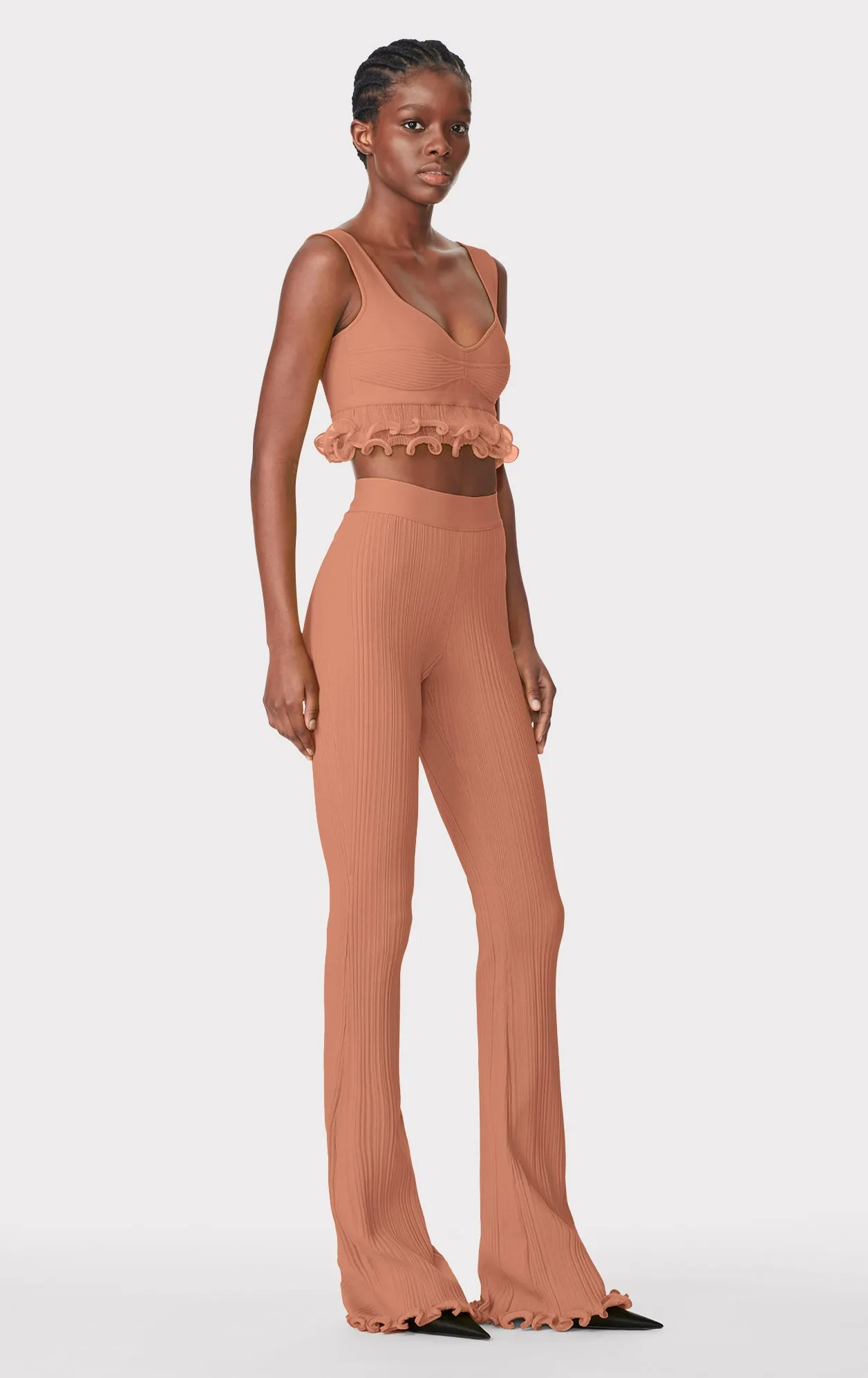 RIBBED PANTS WITH RUFFLED HEM