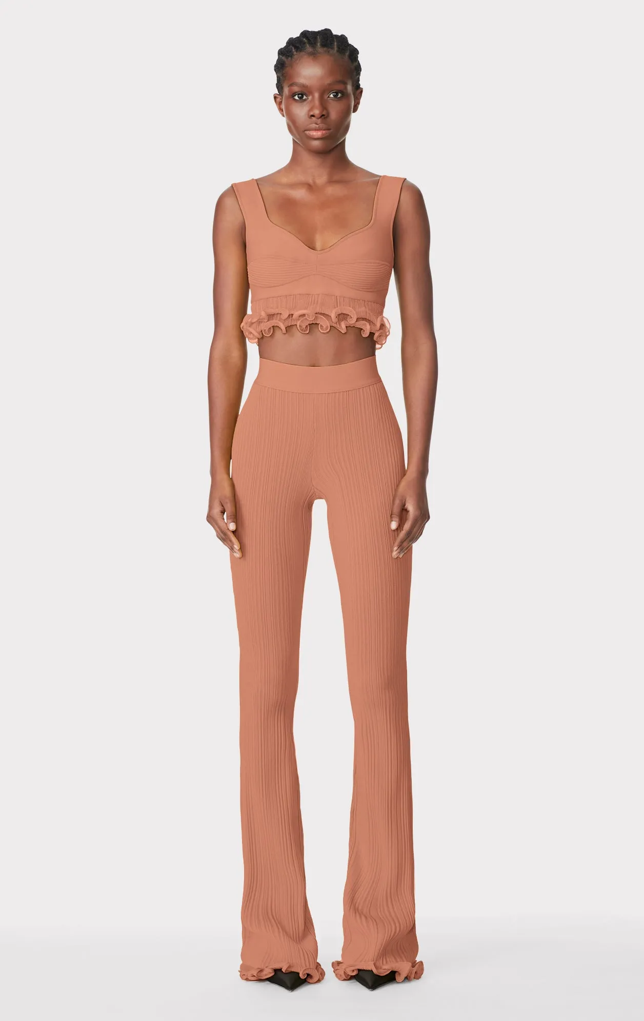 RIBBED PANTS WITH RUFFLED HEM